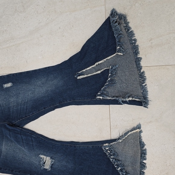 These trendy flare denim jeans feature a bold, boho-chic look with distressed de - Picture 7 of 10